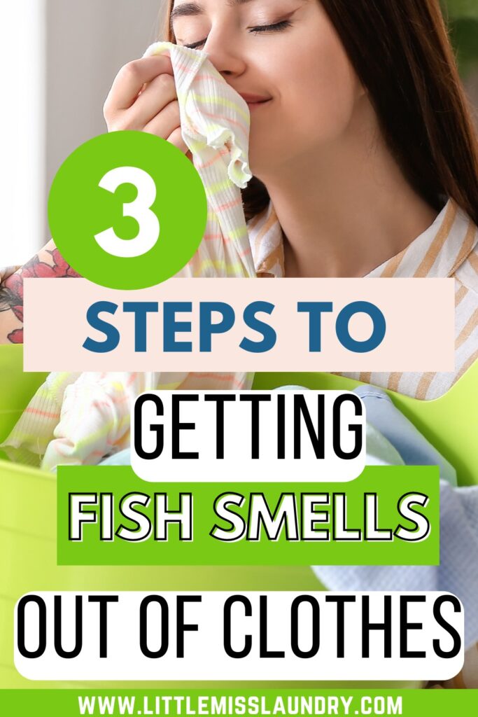 The image is a Pinterest pin with the headline "3 Steps to Getting Fish Smells Out of Clothes" in bold, colorful fonts. The background features a woman holding a piece of fabric close to her nose with a content expression, indicating the fabric's freshness. At the bottom, there is a website URL: "WWW.LITTLEMISSSLAUNDRY.COM."