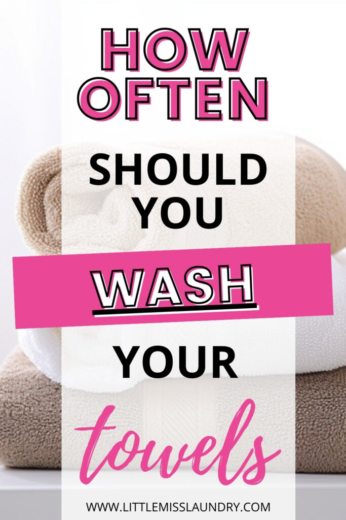 A stack of neatly folded towels in white and beige serves as the background for bold text that reads: 'HOW OFTEN SHOULD YOU WASH YOUR towels,' with 'WASH' highlighted in pink. The website URL 'littlemisslaundry.com' is displayed at the bottom. The design features a mix of black and pink typography, creating a visually engaging and informative look.