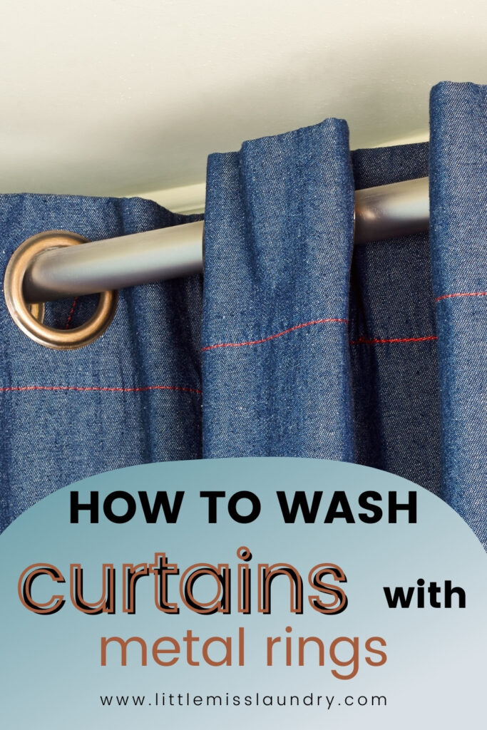 Close-up of blue denim-style curtains hanging on a silver curtain rod with bronze metal rings, paired with bold text reading “How to Wash Curtains with Metal Rings” and the URL littlemisslaundry.com. Image visually supports curtain cleaning tutorials focused on ring-top curtain care.