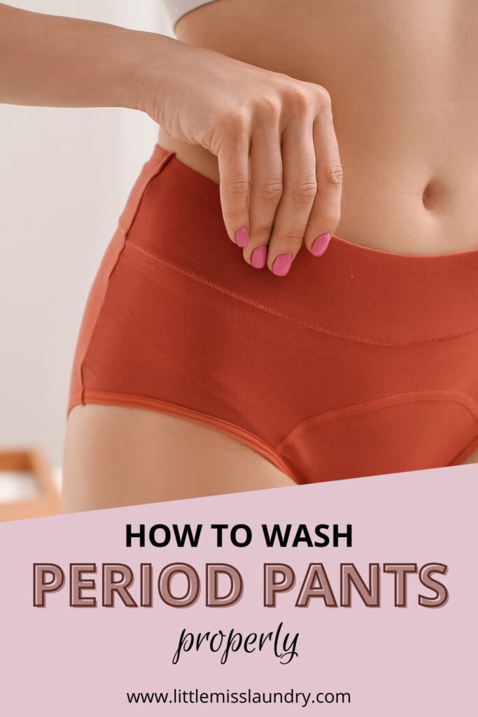Close up of a woman wearing high waisted orange period pants and gently holding the waistband in a bright bathroom. Text on the image reads How to wash period pants properly